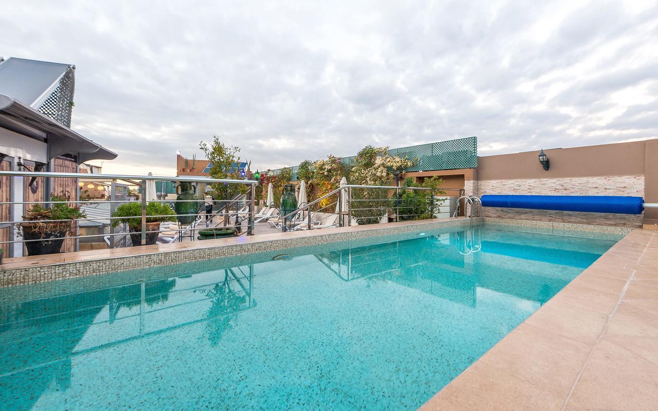 Hotel & Ryad Art Place Marrakech Marraquexe Exterior foto Swimming pool at the hotel